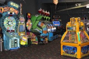 Rows of arcade games glowing inside the Kart Kountry arcade